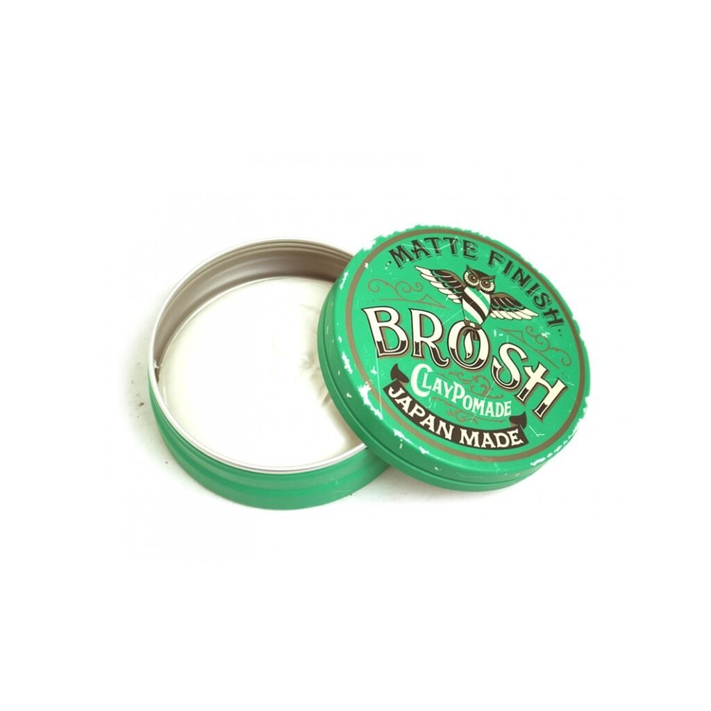 BROSH Matte Finish Clay Pomade - open groen blik met witte inhoud, deksel schuin ertegenaan