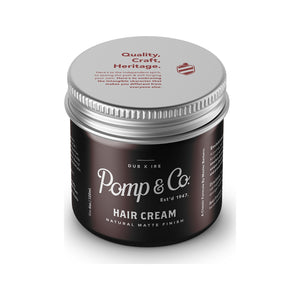 Pomp & Co. Hair Cream, pot marron avec couvercle sur le dessus et texte Quality Craft Heritage