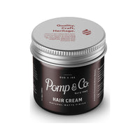 Pomp & Co. Hair Cream, pot marron avec couvercle sur le dessus et texte Quality Craft Heritage